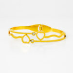 Elegant Gold-Tone Double Heart Bracelet with Minimal Crystal Accents